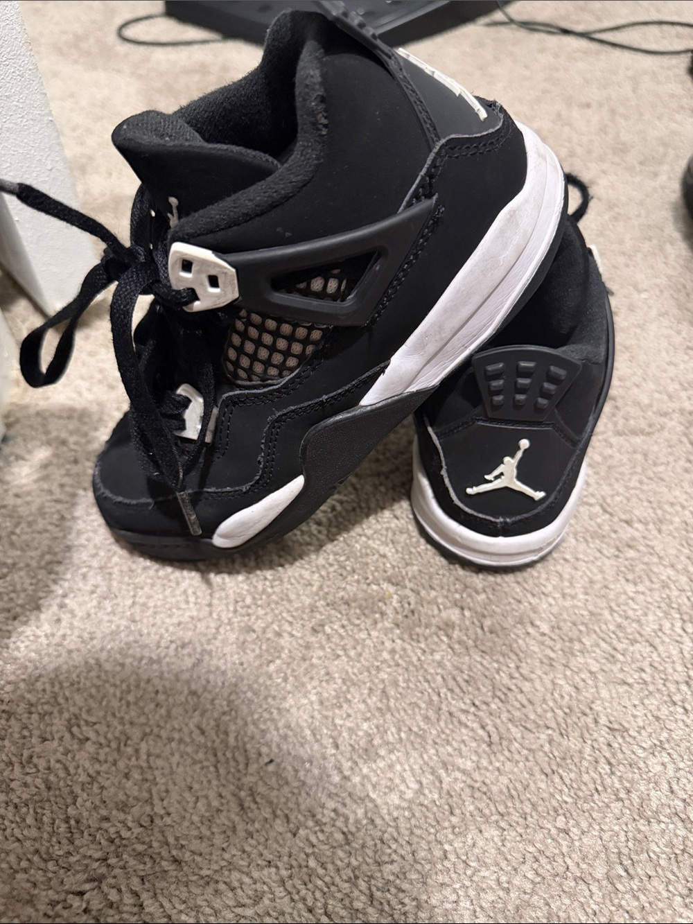 Jordan Kids Black and White High-Top Sneakers